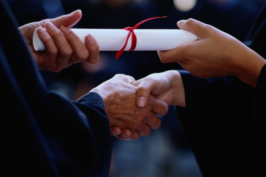 student getting the diploma